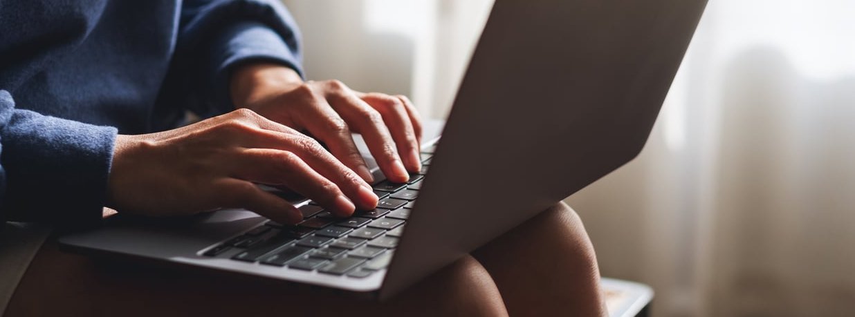 copywriter laptop typing