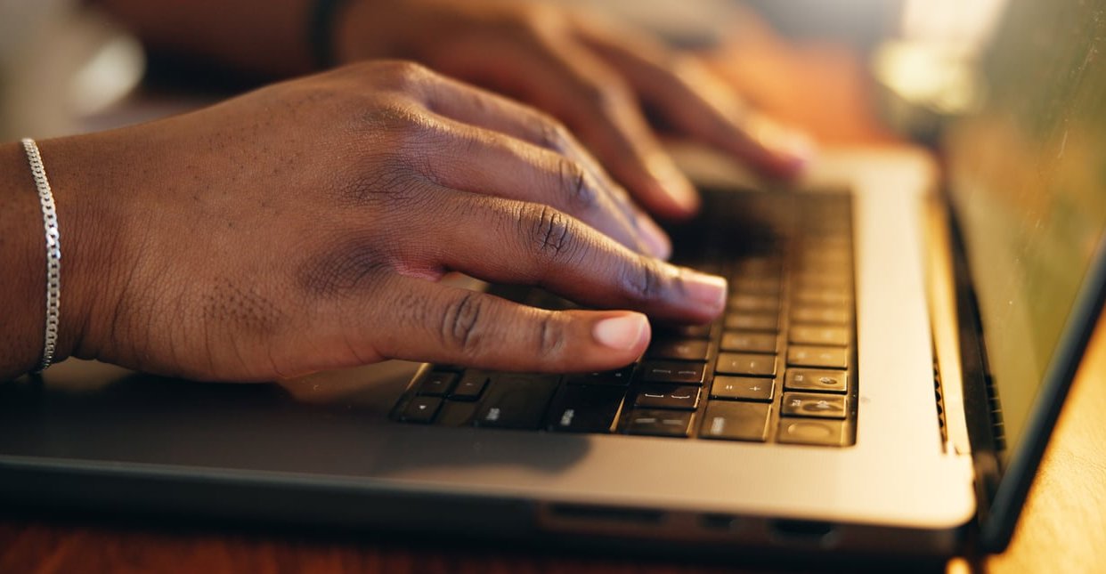 copywriter laptop typing